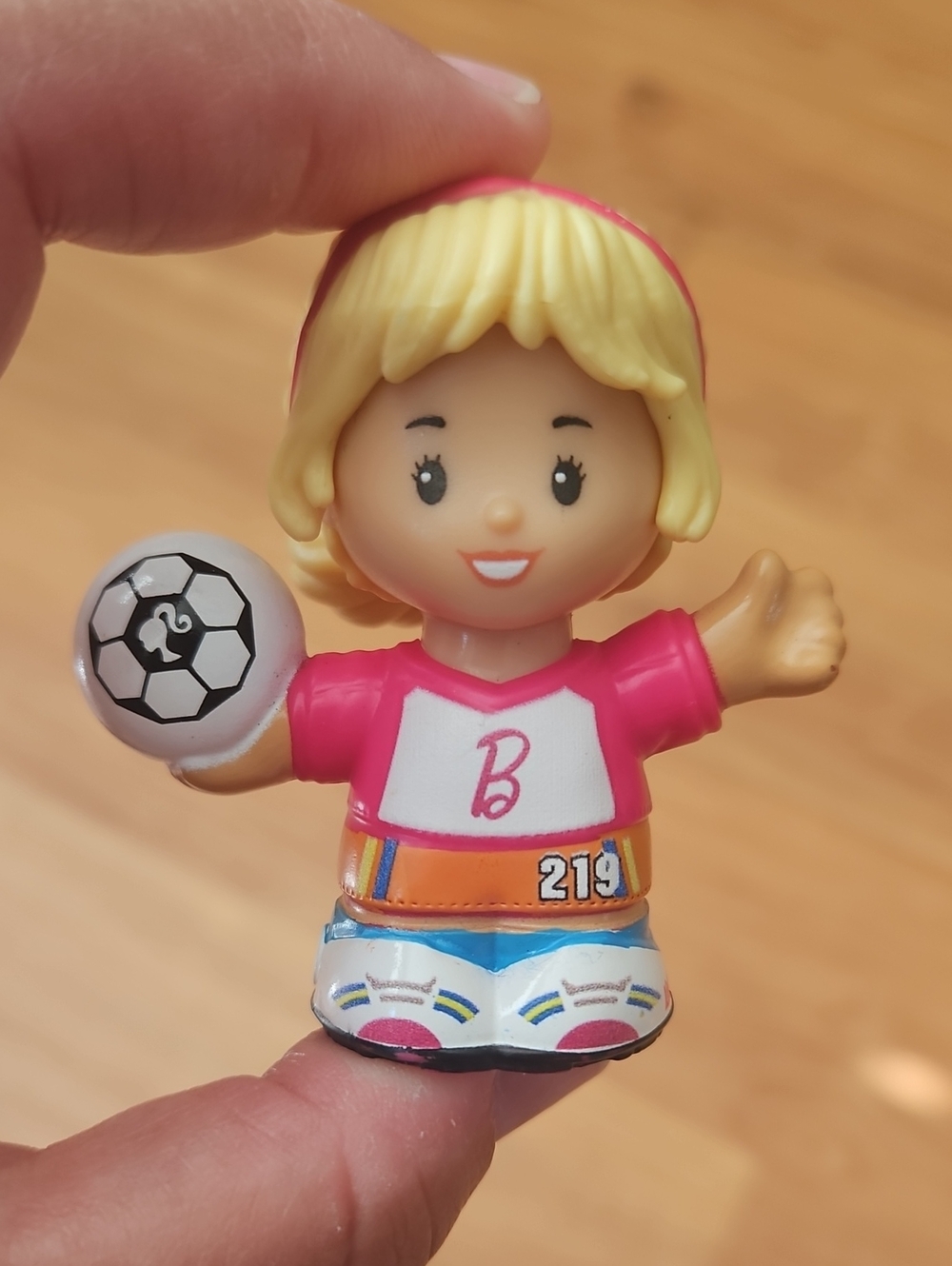 Fisher-Price Little People figure styled as a Barbie girl soccer player